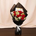 Red Roses And Alstroemeria In Black Wrapping