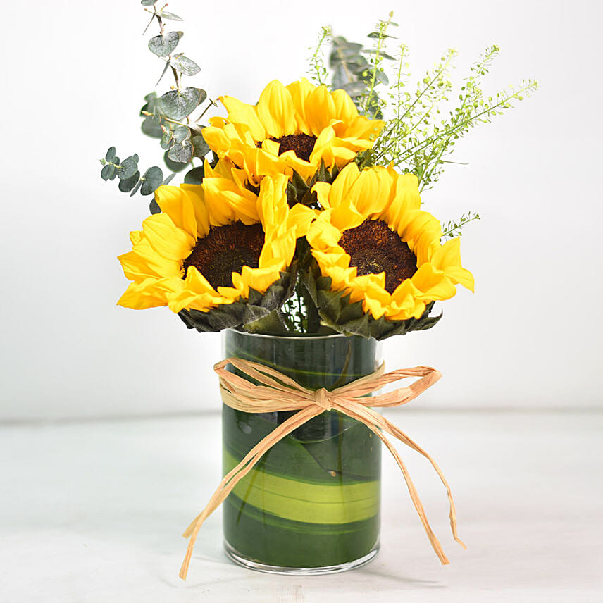 Lovely Sunflowers In Round Glass Vase