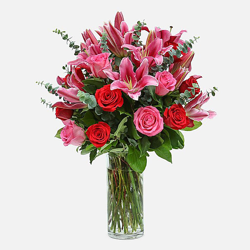 Mixed Roses Stargazer Lilies In Glass Vase Arrangement