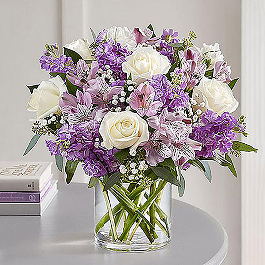 White And Purple Floral Bunch In Glass Vase