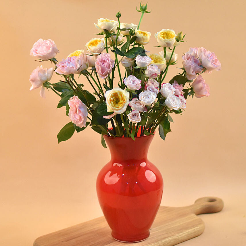 Mixed Spray Roses In Oval Shaped Red Vase