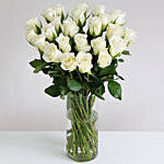 White Roses In Hurricane Vase
